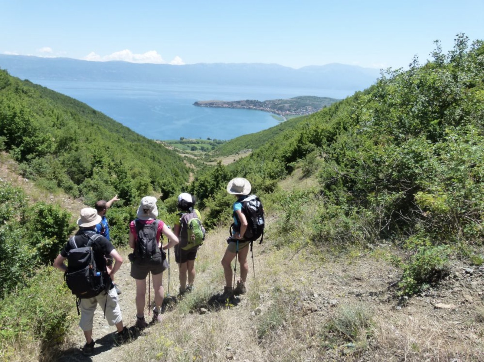 An Adriatik Tours guide leading travellers on the ground above Lake Ohrid