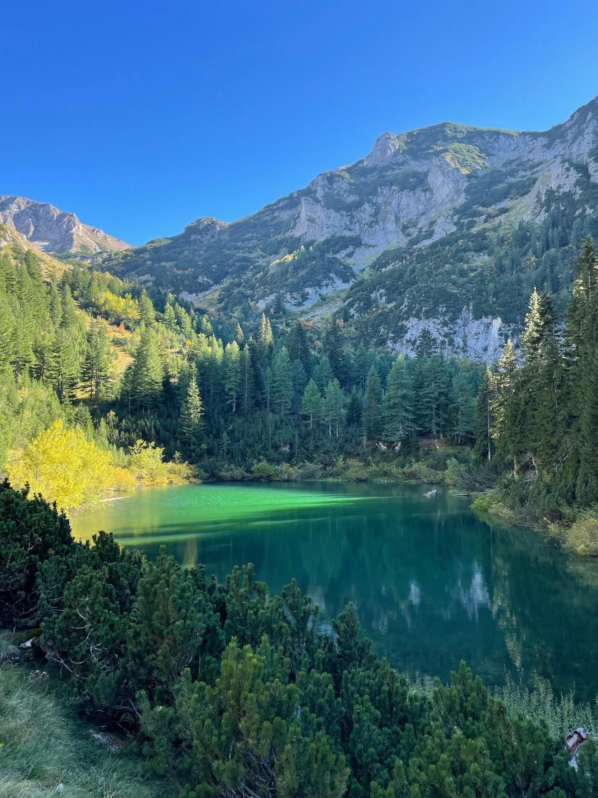 Serene mountain lake evoking the Queen Teuta Spa
